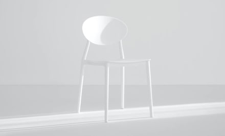 White chair in a white room.